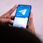 hands holding smartphone